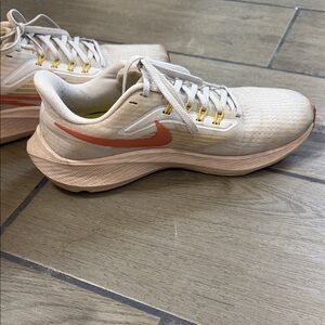 Nike Women’s White Running Shoes with Coral and Yellow Accents